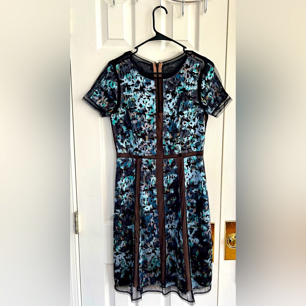 BCBG knee length cocktail dress can fit 6/8. Elegant + unique design.